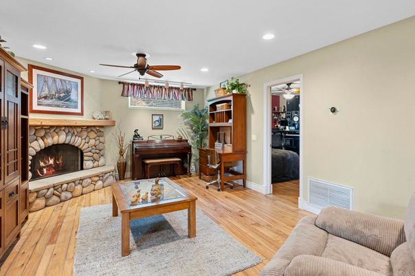 Fireplace, Interior, Living room, Piano, Recessed Lighting, Wood Texture Flooring