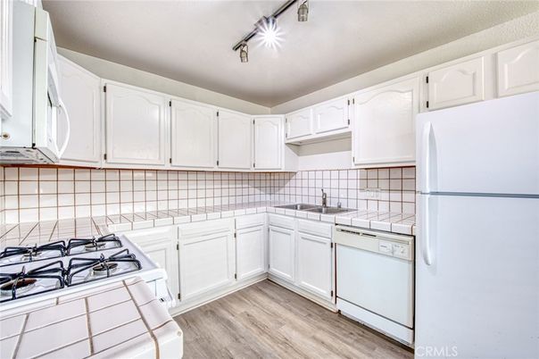 Interior, Kitchen, Tile Countertops, Wood Texture Flooring