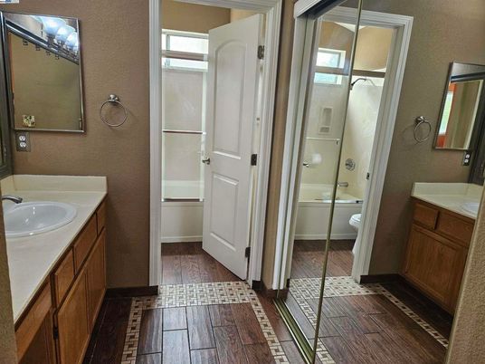 Bathroom, Dual Sink Vanities, Glass Shower, Interior, Wood Texture Flooring