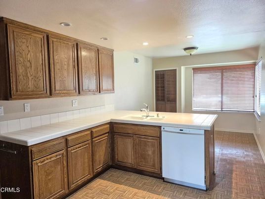 Interior, Kitchen, Recessed Lighting, Tile Countertops, Wood Texture Flooring