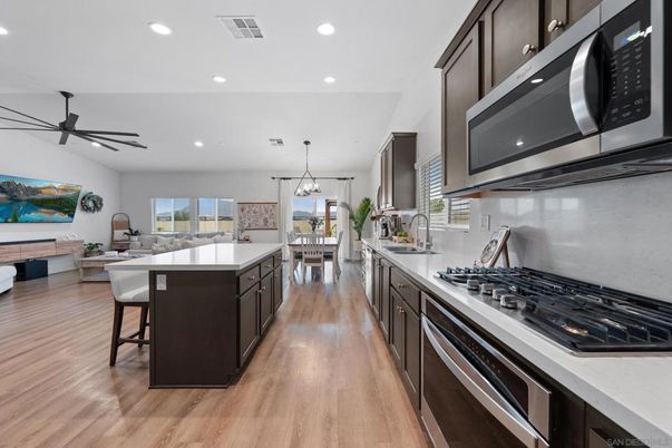 Dining room, Interior, Kitchen, Living room, Pendant Lights, Recessed Lighting, Stainless Steel Appliances, Wood Texture Flooring