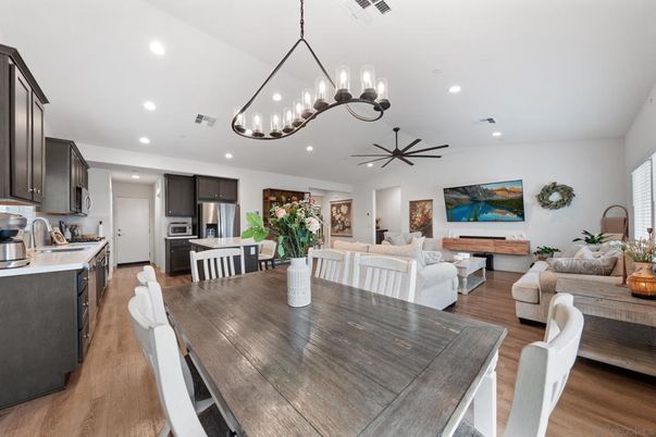 Chandelier, Dining room, Interior, Kitchen, Living room, Pendant Lights, Recessed Lighting, Stainless Steel Appliances, Wood Texture Flooring