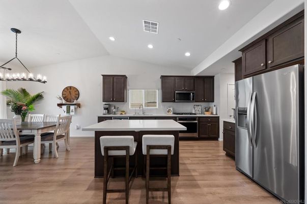 Dining room, Interior, Kitchen, Pendant Lights, Recessed Lighting, Stainless Steel Appliances, Wood Texture Flooring