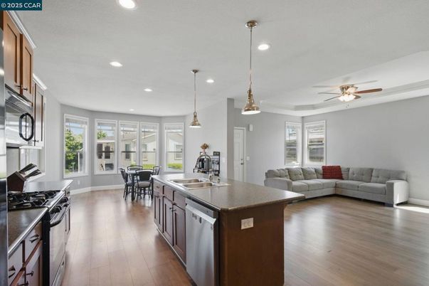Dining room, Interior, Kitchen, Living room, Pendant Lights, Recessed Lighting, Stainless Steel Appliances, Wood Texture Flooring
