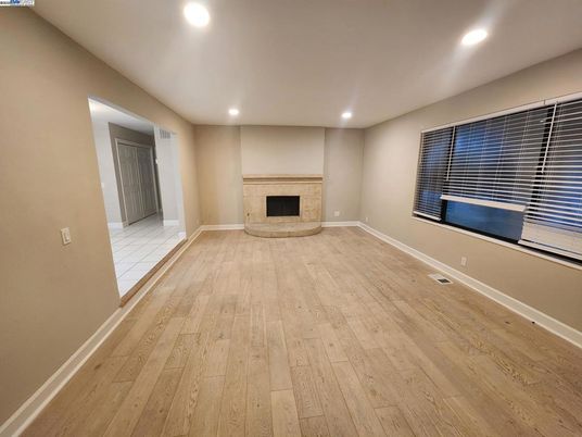 Empty room, Fireplace, Interior, Recessed Lighting, Wood Texture Flooring