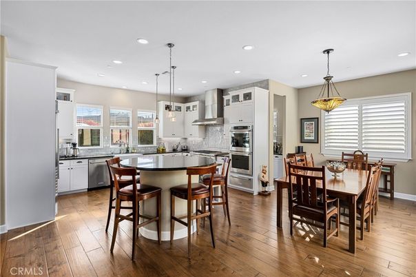Dining room, Interior, Kitchen, Pendant Lights, Recessed Lighting, Stainless Steel Appliances, Wood Texture Flooring