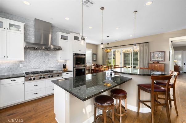 Dining room, Interior, Kitchen, Pendant Lights, Recessed Lighting, Stainless Steel Appliances, Wood Texture Flooring