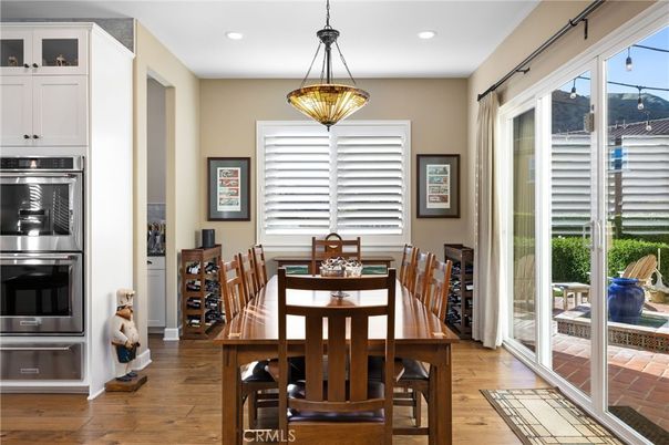 Dining room, Interior, Pendant Lights, Recessed Lighting, Stainless Steel Appliances, Wood Texture Flooring