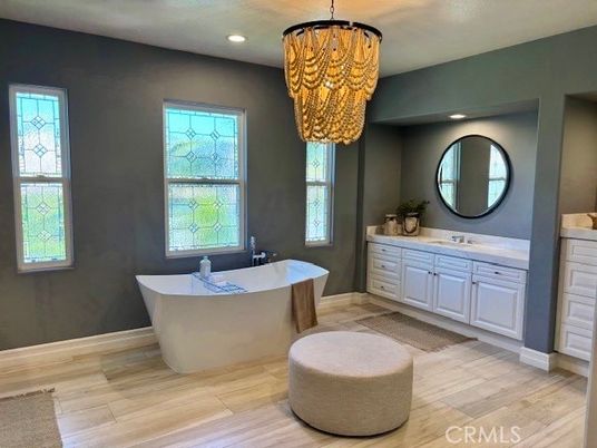 Bathroom, Chandelier, Dual Sink Vanities, Free Standing Baths, Interior, Recessed Lighting, Wood Texture Flooring