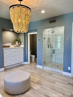 Bathroom, Chandelier, Glass Shower, Interior, Recessed Lighting, Wood Texture Flooring
