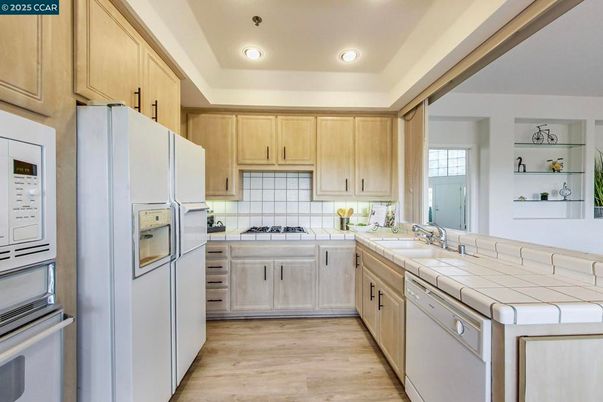 Interior, Kitchen, Recessed Lighting, Tile Countertops, Wood Texture Flooring