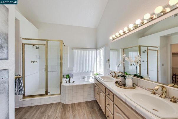 Bathroom, Dual Sink Vanities, Glass Shower, Interior, Tile Countertops, Wood Texture Flooring