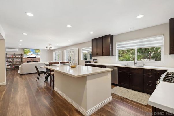 Chandelier, Dining room, Fireplace, Interior, Kitchen, Recessed Lighting, Wood Texture Flooring
