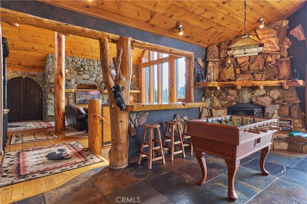 Fireplace, Game Room, Interior, Pendant Lights, Stone Walls, Wooden Ceilings