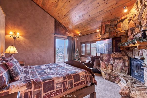 Bedroom, Fireplace, Interior, Recessed Lighting, Stone Walls, Wooden Ceilings