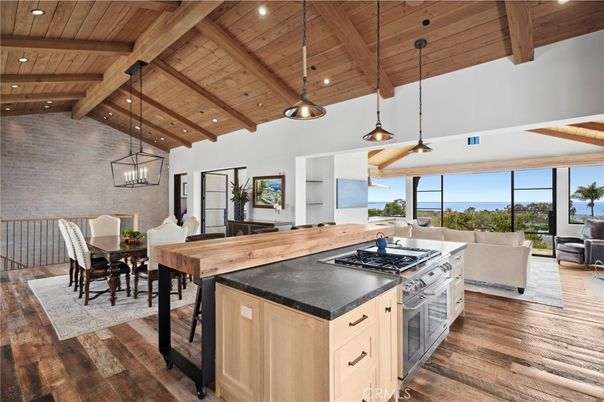 Dining room, Interior, Kitchen, Living room, Pendant Lights, Recessed Lighting, Stainless Steel Appliances, Water, Wooden Beams, Wooden Ceilings, Wood Texture Flooring