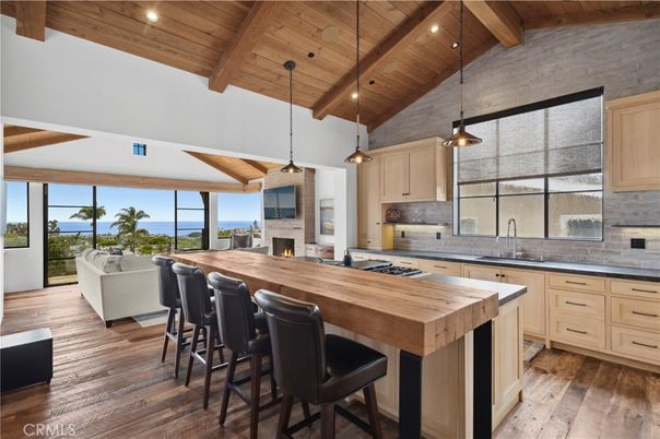 Fireplace, Interior, Kitchen, Living room, Pendant Lights, Recessed Lighting, Stainless Steel Appliances, Water, Wooden Beams, Wooden Ceilings, Wood Texture Flooring