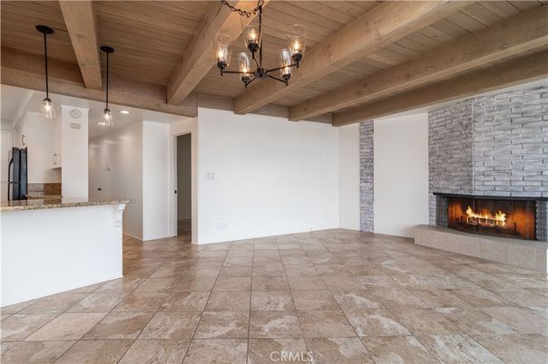 Empty room, Fireplace, Interior, Pendant Lights, Stone Walls, Wooden Beams, Wooden Ceilings