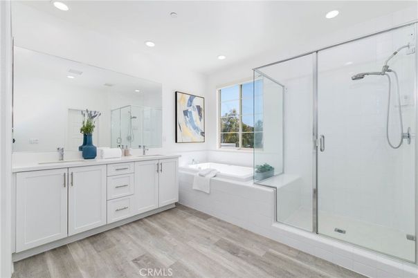 Bathroom, Dual Sink Vanities, Glass Shower, Interior, Recessed Lighting, Wood Texture Flooring