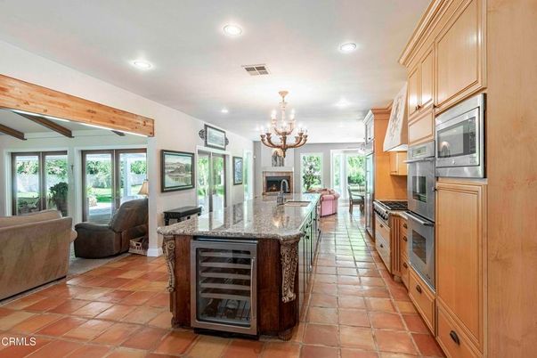Chandelier, Fireplace, Interior, Kitchen, Living room, Recessed Lighting, Stainless Steel Appliances