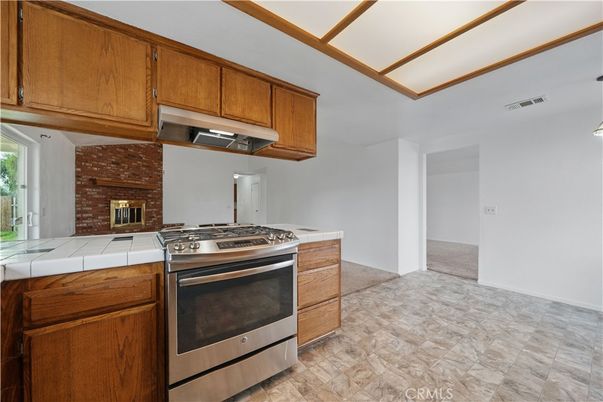Fireplace, Interior, Kitchen, Stainless Steel Appliances, Tile Countertops