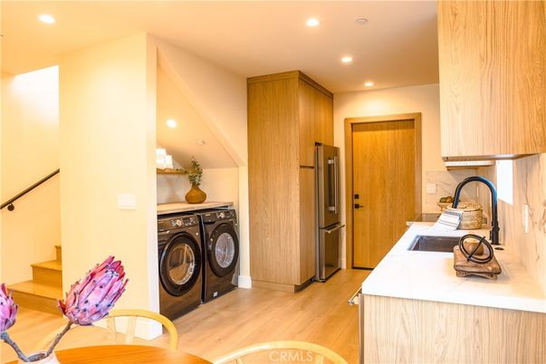 Interior, Kitchen, Recessed Lighting, Washer, Wood Texture Flooring