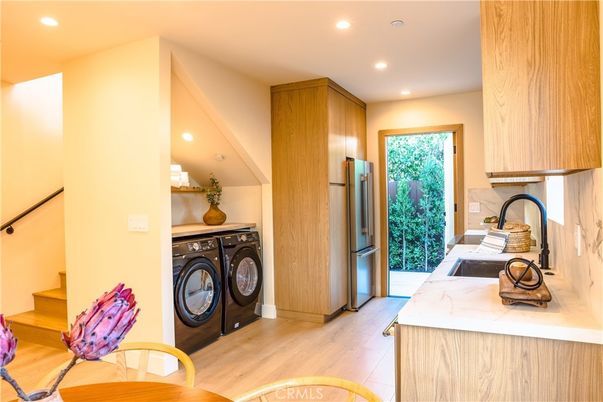 Interior, Kitchen, Recessed Lighting, Washer, Wood Texture Flooring