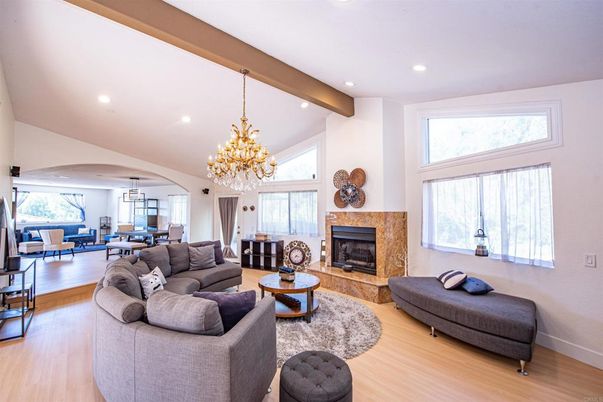 Chandelier, Dining room, Fireplace, Interior, Living room, Pendant Lights, Recessed Lighting, Wooden Beams, Wood Texture Flooring