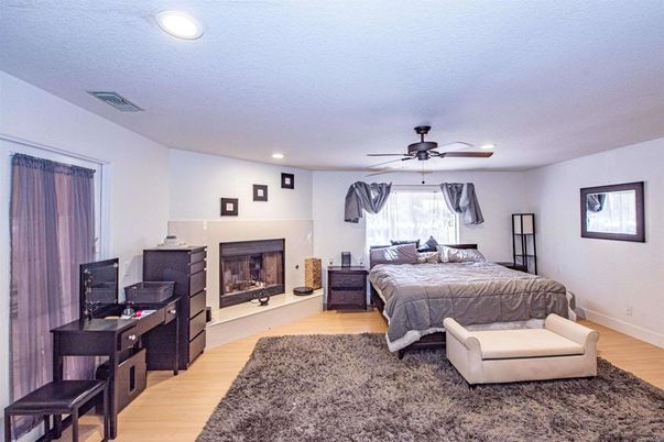 Bedroom, Fireplace, Interior, Recessed Lighting, Wood Texture Flooring
