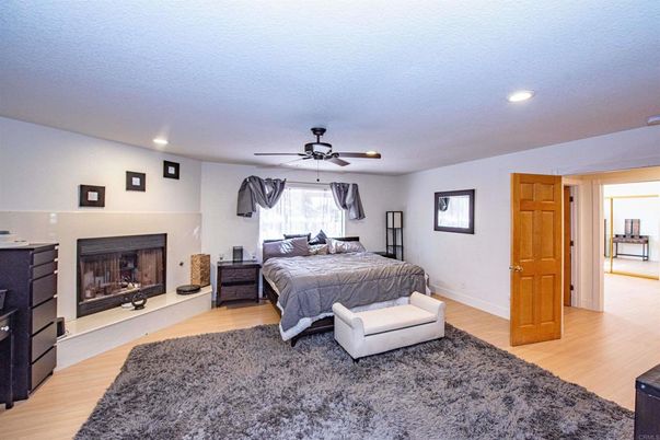 Bedroom, Fireplace, Interior, Recessed Lighting, Wood Texture Flooring