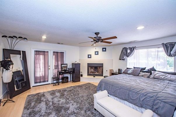 Bedroom, Fireplace, Interior, Recessed Lighting, Wood Texture Flooring
