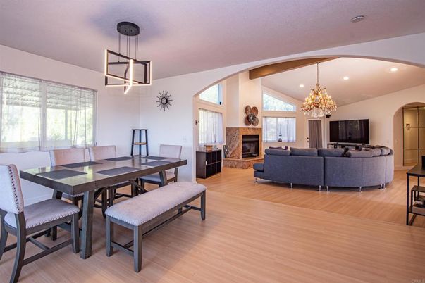 Chandelier, Dining room, Fireplace, Interior, Living room, Pendant Lights, Recessed Lighting, Wooden Beams, Wood Texture Flooring