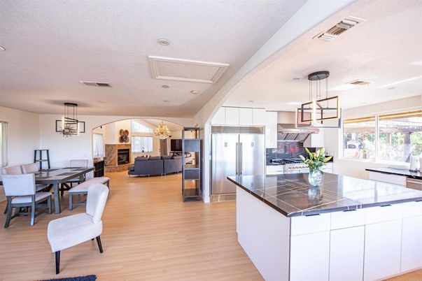 Dining room, Fireplace, Interior, Kitchen, Living room, Pendant Lights, Recessed Lighting, Stainless Steel Appliances, Wood Texture Flooring