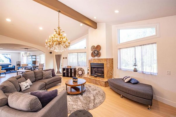 Chandelier, Dining room, Fireplace, Interior, Living room, Pendant Lights, Recessed Lighting, Wooden Beams, Wood Texture Flooring
