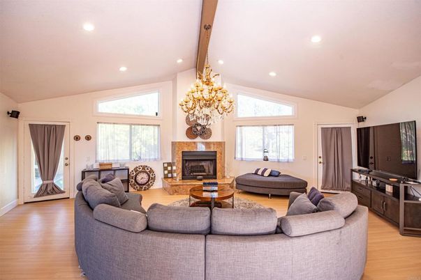 Chandelier, Fireplace, Interior, Living room, Recessed Lighting, Wood Texture Flooring