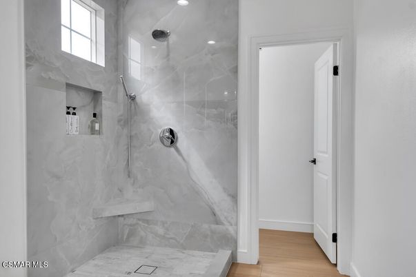 Bathroom, Glass Shower, Interior, Marble Walls, Recessed Lighting, Wood Texture Flooring