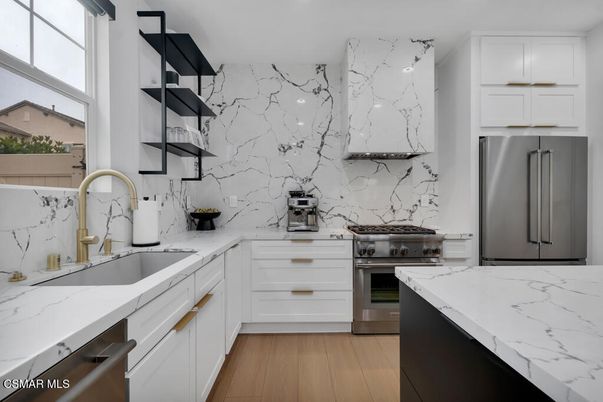 Interior, Kitchen, Marble Walls, Recessed Lighting, Stainless Steel Appliances, Wood Texture Flooring