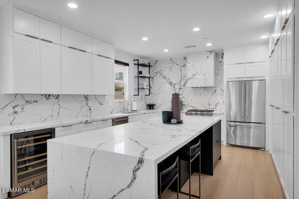 Interior, Kitchen, Marble Walls, Recessed Lighting, Stainless Steel Appliances, Wood Texture Flooring
