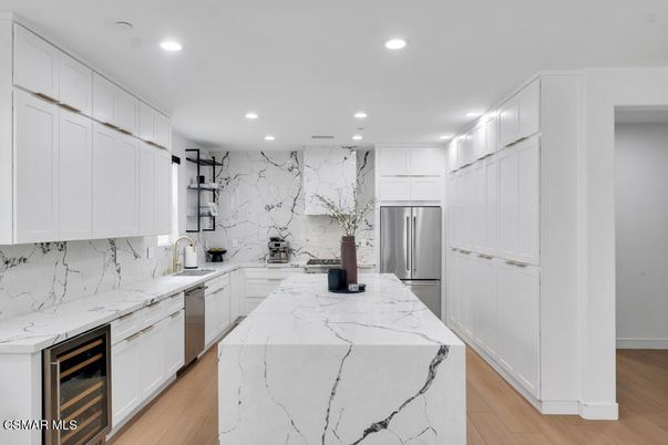 Interior, Kitchen, Marble Walls, Recessed Lighting, Stainless Steel Appliances, Wood Texture Flooring