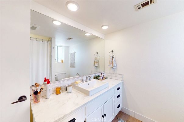 Bathroom, Dual Sink Vanities, Interior, Recessed Lighting, Wood Texture Flooring