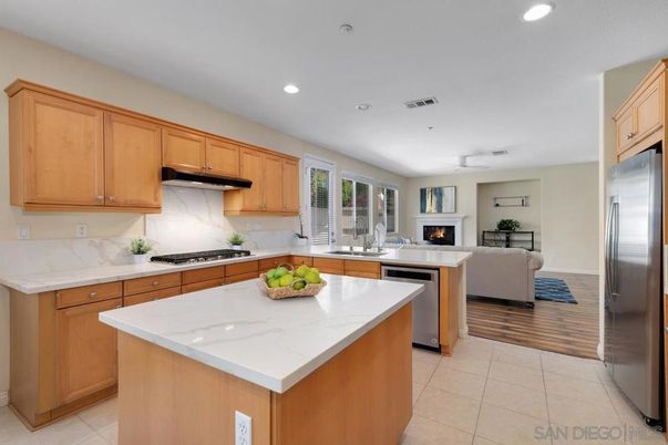 Fireplace, Interior, Kitchen, Living room, Recessed Lighting, Stainless Steel Appliances, Wood Texture Flooring