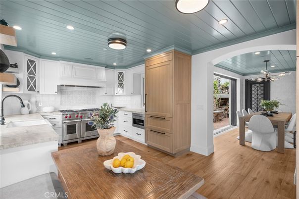 Dining room, Interior, Kitchen, Pendant Lights, Recessed Lighting, Stainless Steel Appliances, Wood Texture Flooring