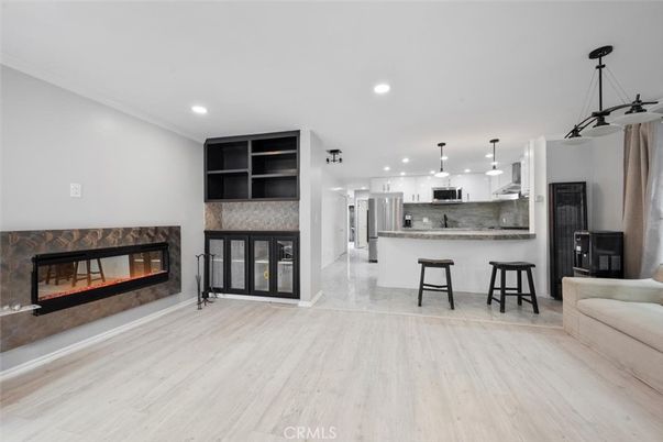 Fireplace, Interior, Kitchen, Pendant Lights, Recessed Lighting, Stainless Steel Appliances, Wood Texture Flooring