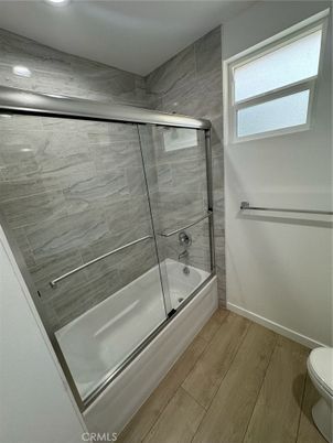 Bathroom, Glass Shower, Interior, Marble Walls, Recessed Lighting, Wood Texture Flooring