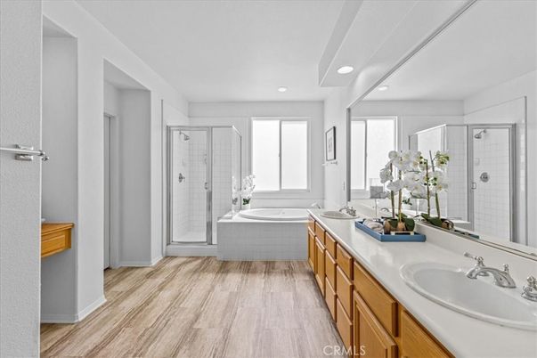 Bathroom, Dual Sink Vanities, Glass Shower, Interior, Recessed Lighting, Wood Texture Flooring