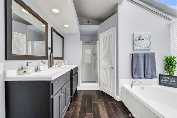 Bathroom, Dual Sink Vanities, Glass Shower, Interior, Recessed Lighting, Wood Texture Flooring