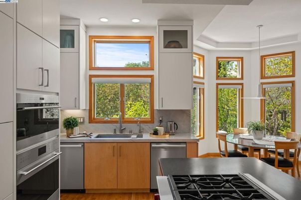 Dining room, Interior, Kitchen, Pendant Lights, Recessed Lighting, Stainless Steel Appliances, Wood Texture Flooring