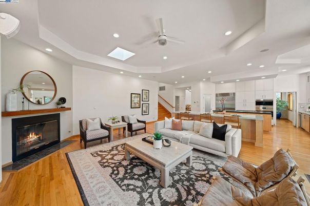 Fireplace, Interior, Kitchen, Living room, Recessed Lighting, Stainless Steel Appliances, Wood Texture Flooring