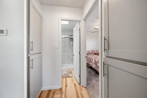 Bathroom, Glass Shower, Interior, Marble Walls, Wood Texture Flooring