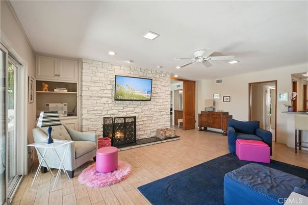 Fireplace, Interior, Living room, Recessed Lighting, Stone Walls, Wood Texture Flooring